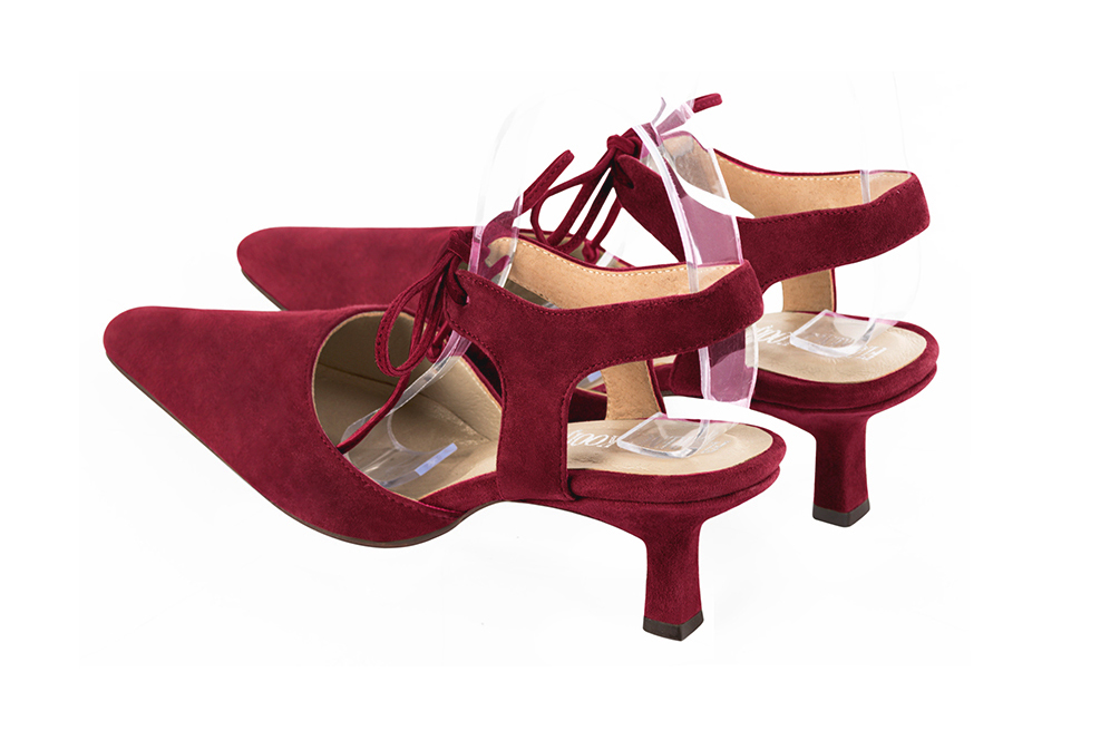 Women's burgundy red elegant closed-toe heels, with an instep strap. Tapered toe. Medium spool heels - Rear view